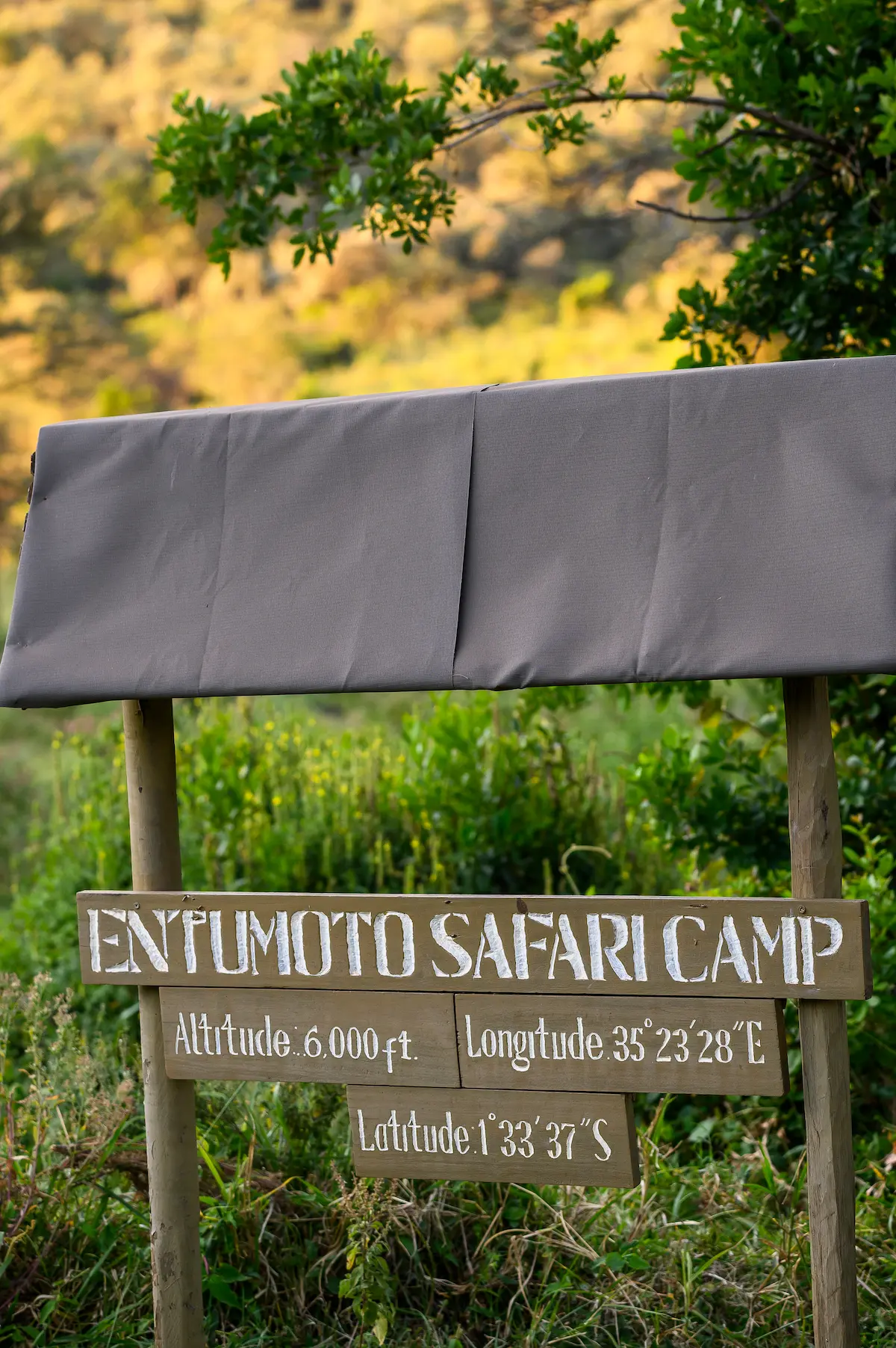 Entumoto Safari Camp entrance sign at 6,000 feet above sea level, Maasai Mara Conservancy. Photo: Vanessa Knight