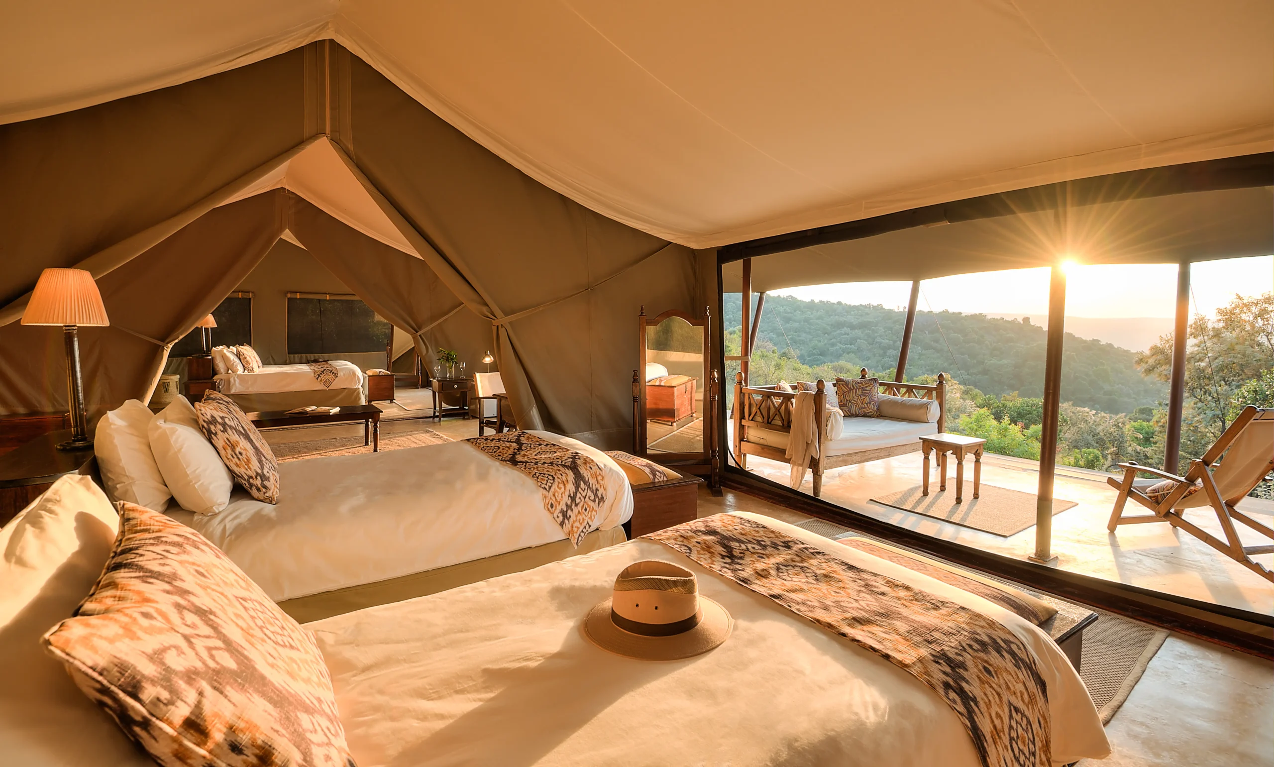 Twin beds bathed in golden evening light at Entumoto Safari Camp, Maasai Mara. Photo: Vanessa Knight