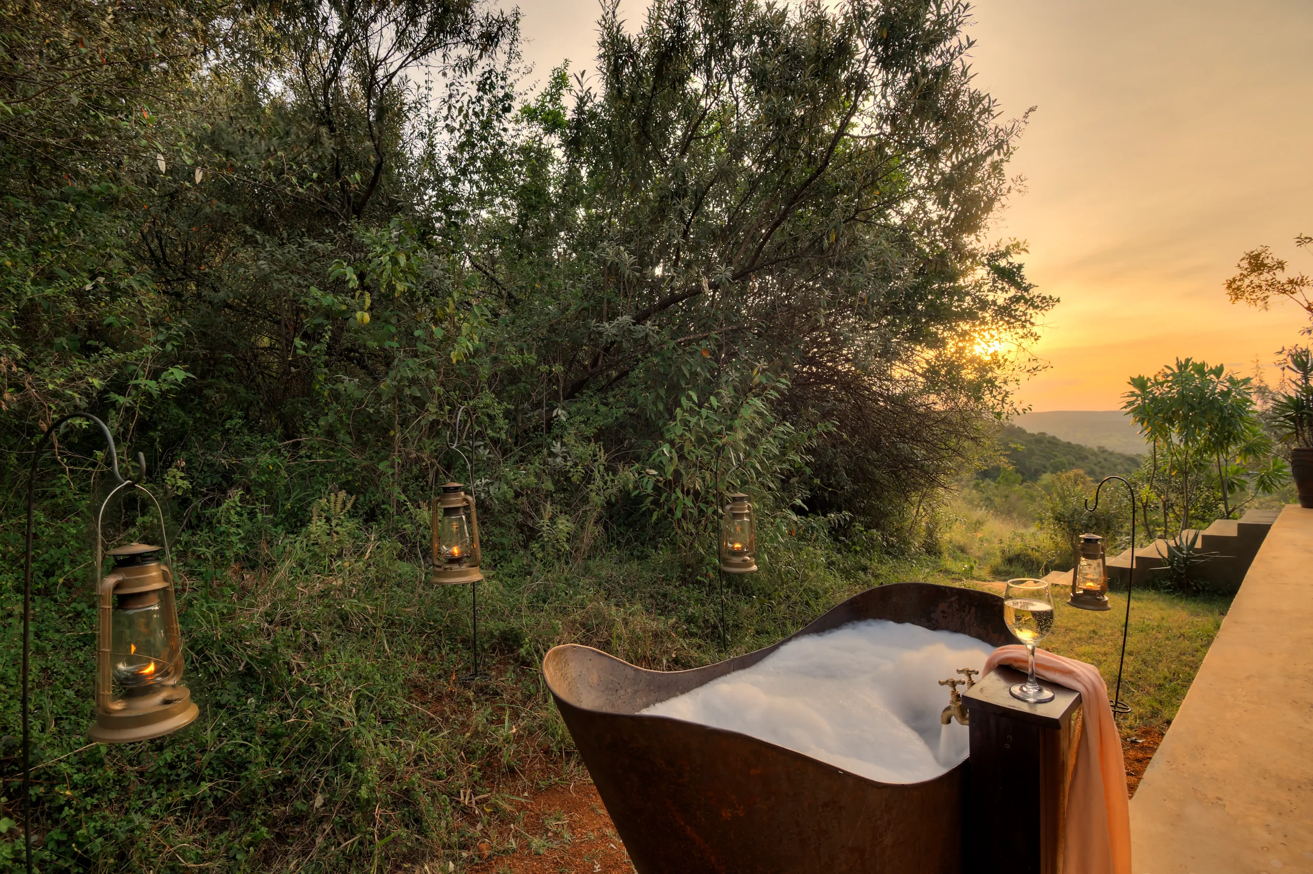 Copper bathtub on a private deck at sunset, Entumoto Safari Camp, Maasai Mara. Photo: Vanessa Knight